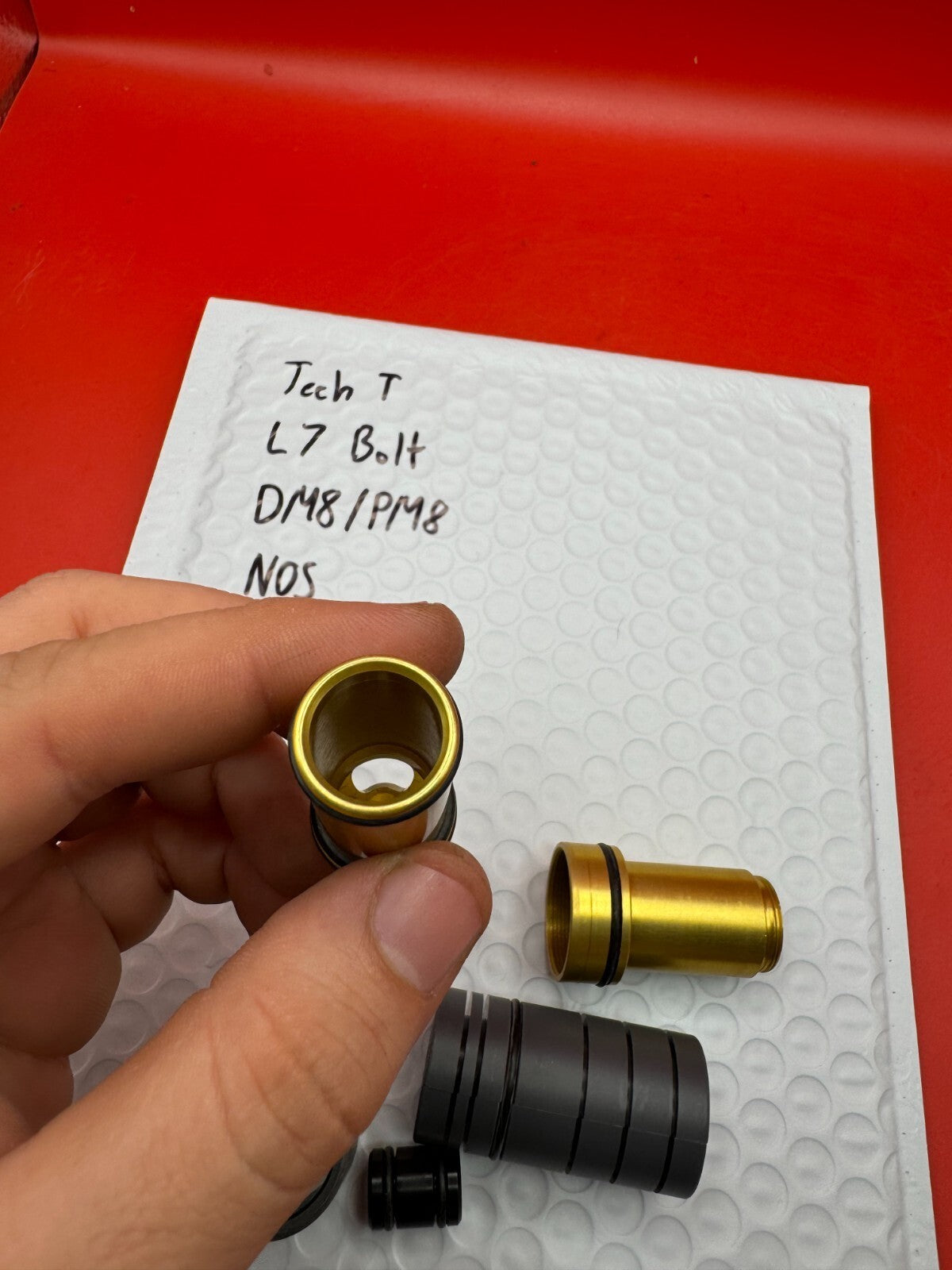 Tech T L7 Bolt DM8/PM8 NOS - used paintball bolt - gold/black