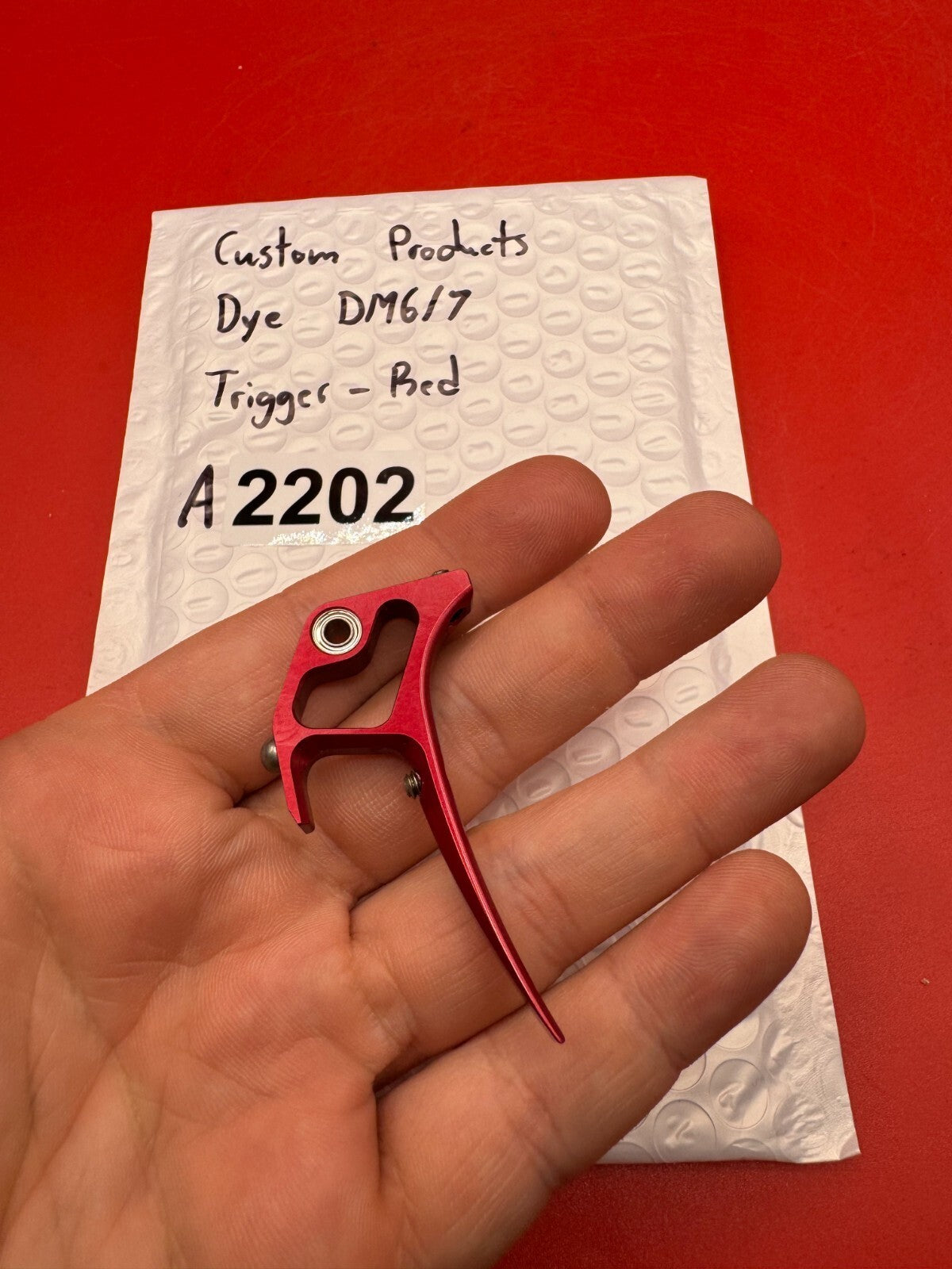 Custom products Dye DM6/7 Trigger-Red - used paintball trigger - red anno