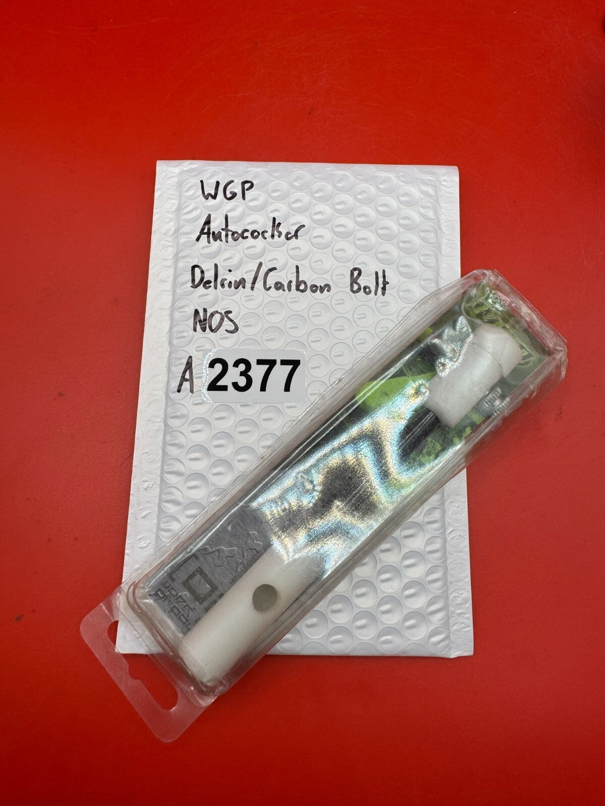 WGP Autococker Delrin/Carbon Bolt NOS White - used paintball bolt - white/black