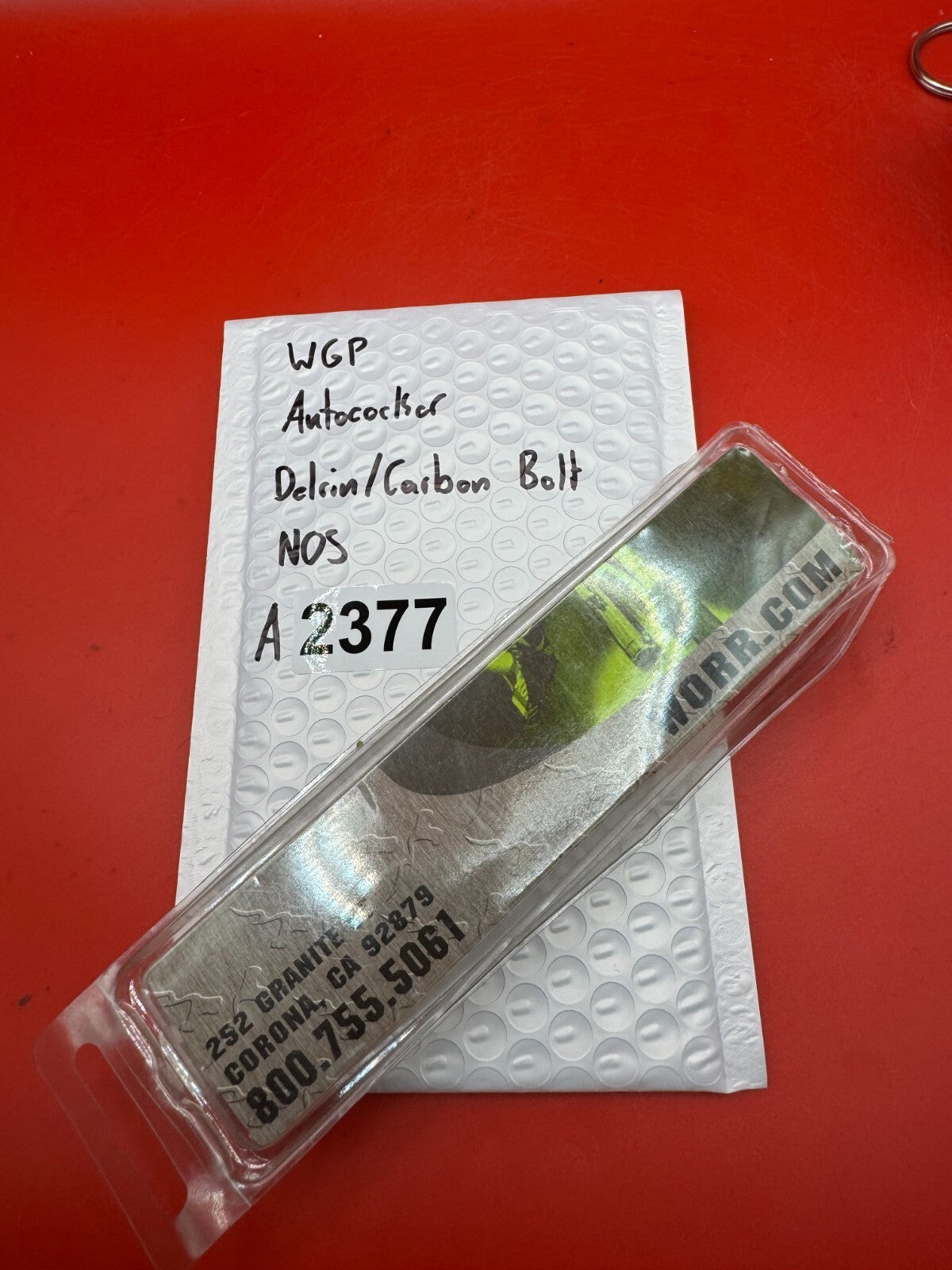 WGP Autococker Delrin/Carbon Bolt NOS White - used paintball bolt - white/black