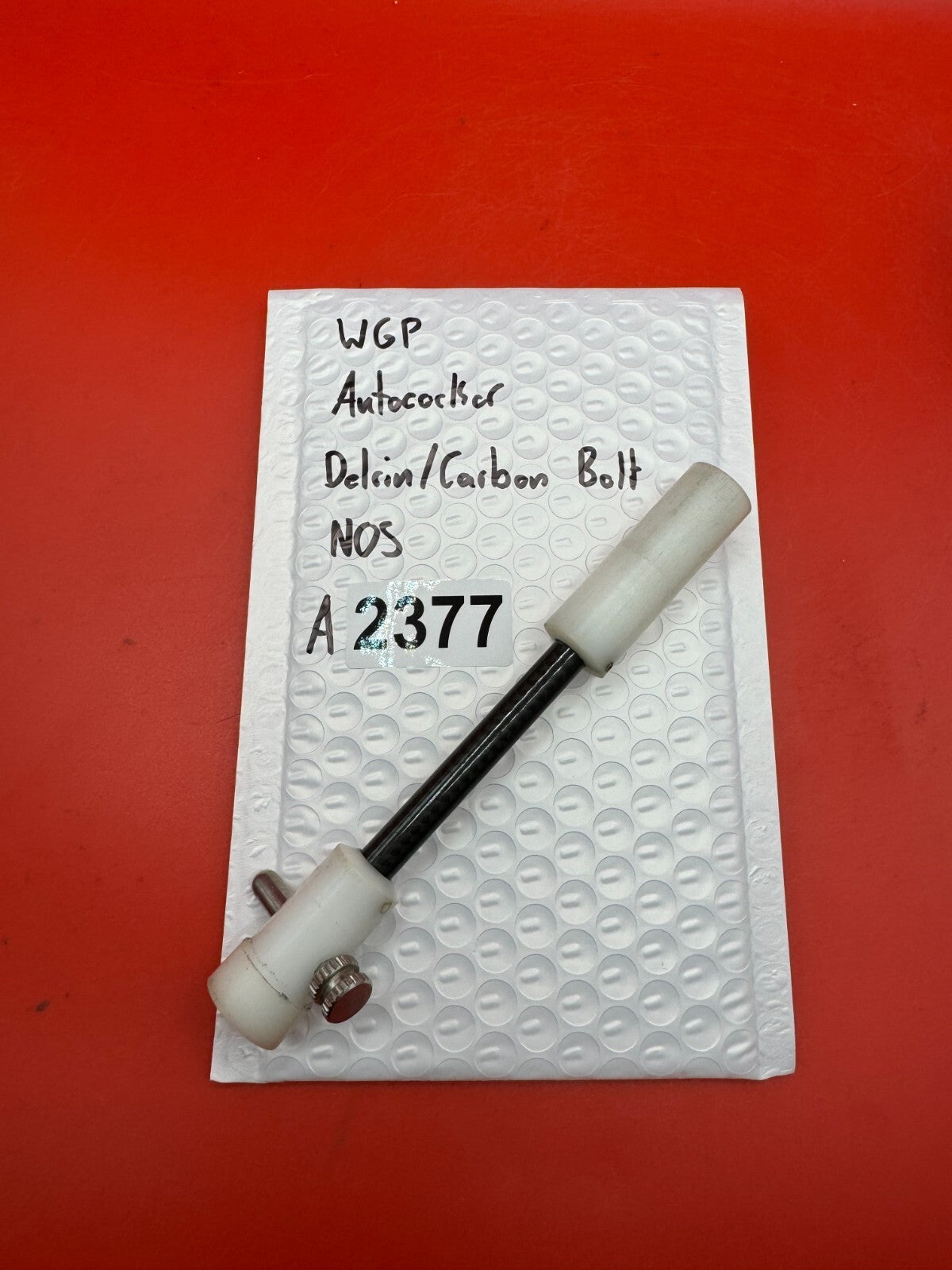 WGP Autococker Delrin/Carbon Bolt NOS White - used paintball bolt - white/black